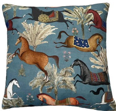 Decorative pillow with horse and nature pattern on a blue background